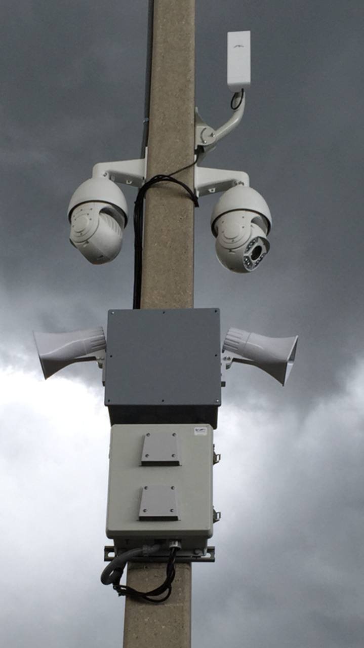 Security camera mounted on building exterior